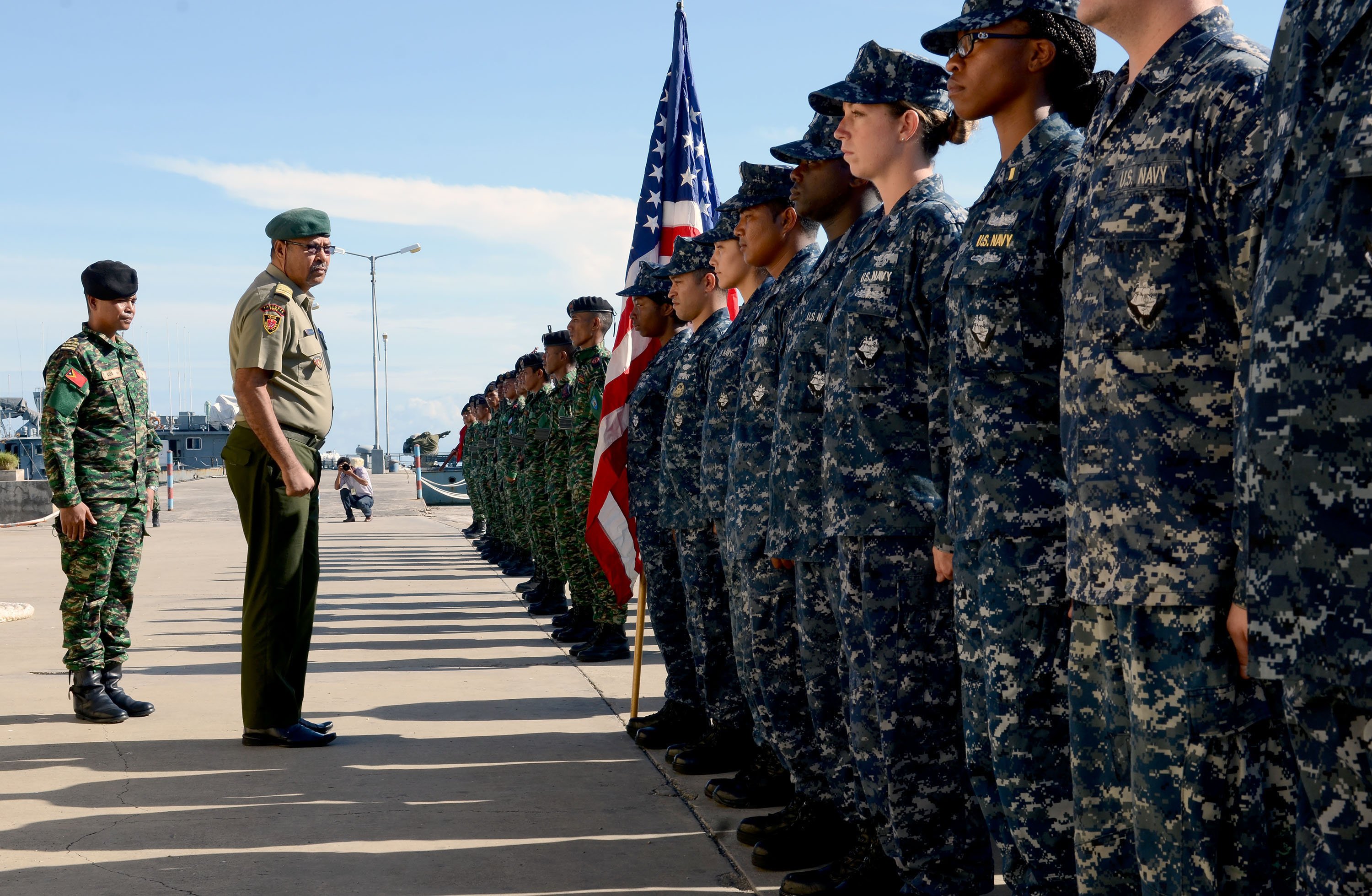Chief of Staff of the Timor-Leste Defense Force Col. Falur Rate Laek, second from left, inspects U.S. Sailors assigned to the guided missile destroyer USS Kidd (DDG 100) and Timor-Leste Defense Force service members Feb. 24, 2014, during the opening ceremony of Cooperation Afloat Readiness and Training (CARAT) 2014 in Port Hera, East Timor. CARAT is a series of bilateral exercises held annually in Southeast Asia to strengthen relationships and enhance force readiness. (DoD photo by Mass Communication Specialist 1st Class Jay C. Pugh, U.S. Navy/Released)